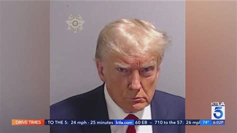 Trump mug shot makes history after surrender at Fulton County jail